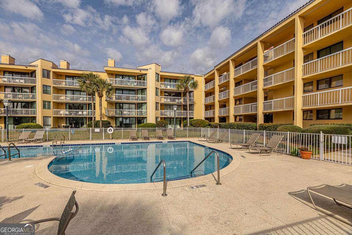 201 Neptune Road, Unit 258 St. Simons, GA 31522 - Photo 41 of 52 a view of a swimming pool with a patio