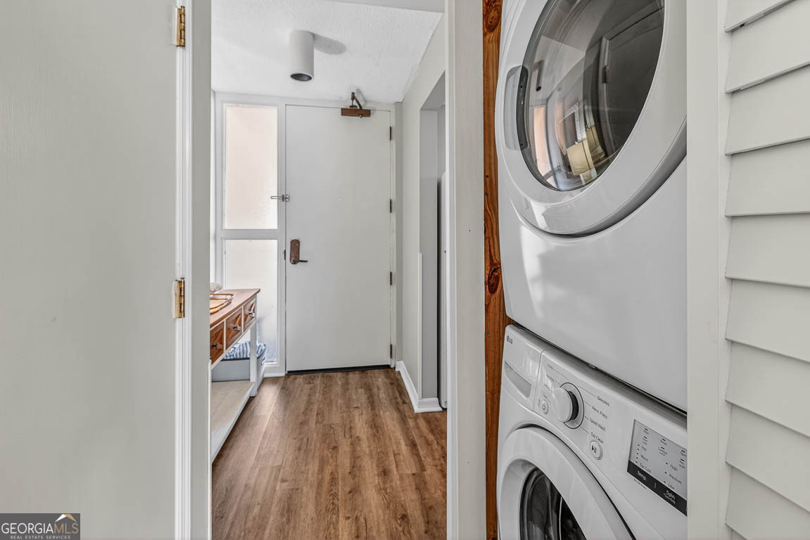 201 Neptune Road, Unit 258 St. Simons, GA 31522 - Photo 10 of 52 a view of a hallway with washer and dryer