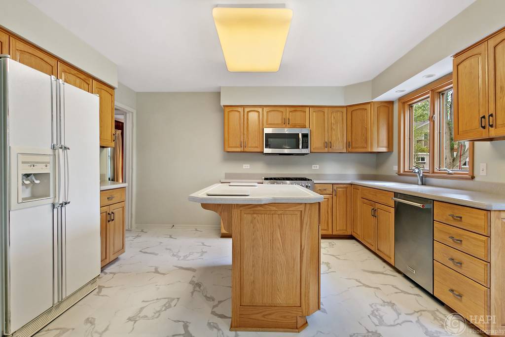 33 Ferndale Road Deer Park, IL 60010 - Photo 11 of 31 a kitchen with stainless steel appliances granite countertop a stove a sink and a refrigerator