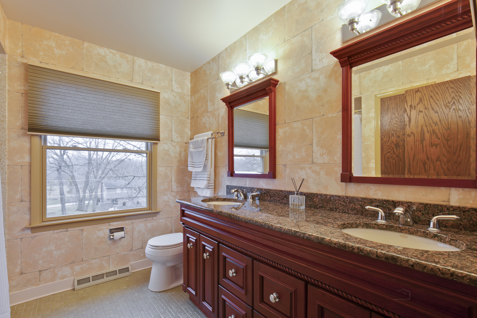 33 Ferndale Road Deer Park, IL 60010 - Photo 20 of 31 a bathroom with a granite countertop toilet a sink a mirror and a window