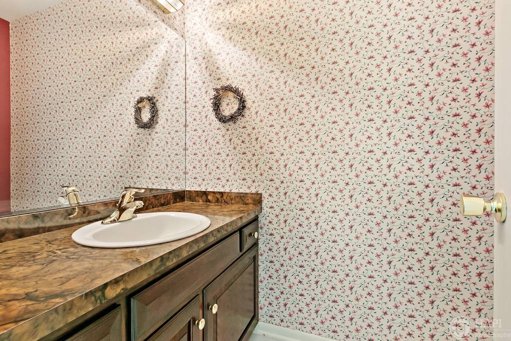 33 Ferndale Road Deer Park, IL 60010 - Photo 28 of 31 a bathroom with a sink and a mirror