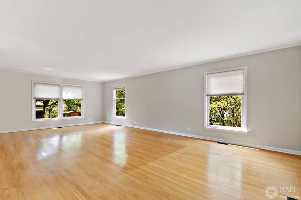 33 Ferndale Road Deer Park, IL 60010 - Photo 5 of 31 a view of an empty room with wooden floor and a window