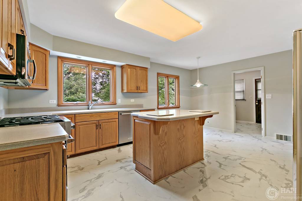 33 Ferndale Road Deer Park, IL 60010 - Photo 10 of 31 a kitchen with stainless steel appliances granite countertop a stove a sink dishwasher and a refrigerator