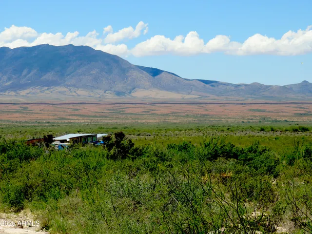 a view of mountain with sunset