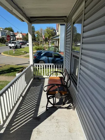 a view of a porch with furniture