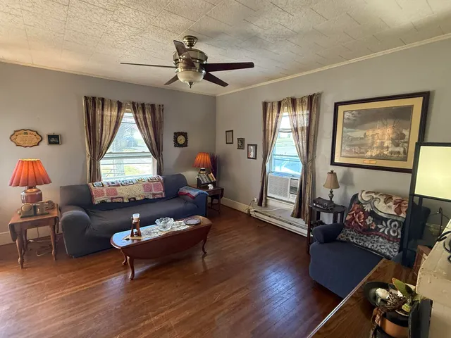 a living room with furniture and a window