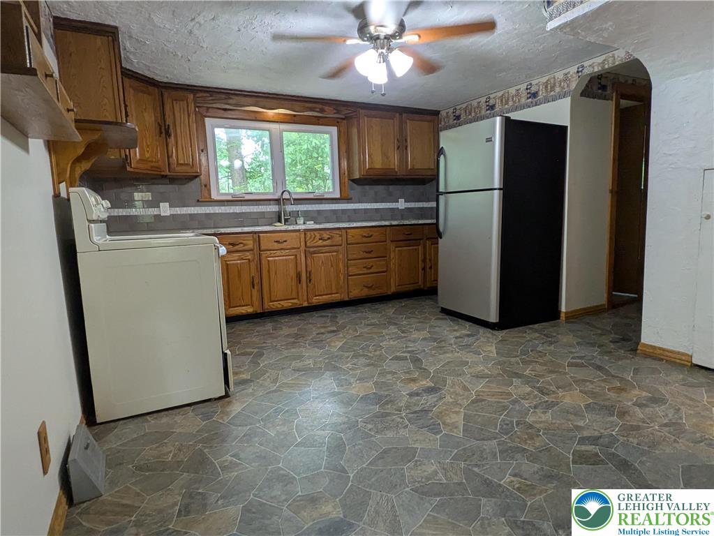 124 Sterling Valley Road Kunkletown, PA 18058 - Photo 15 of 29 a kitchen with refrigerator and window