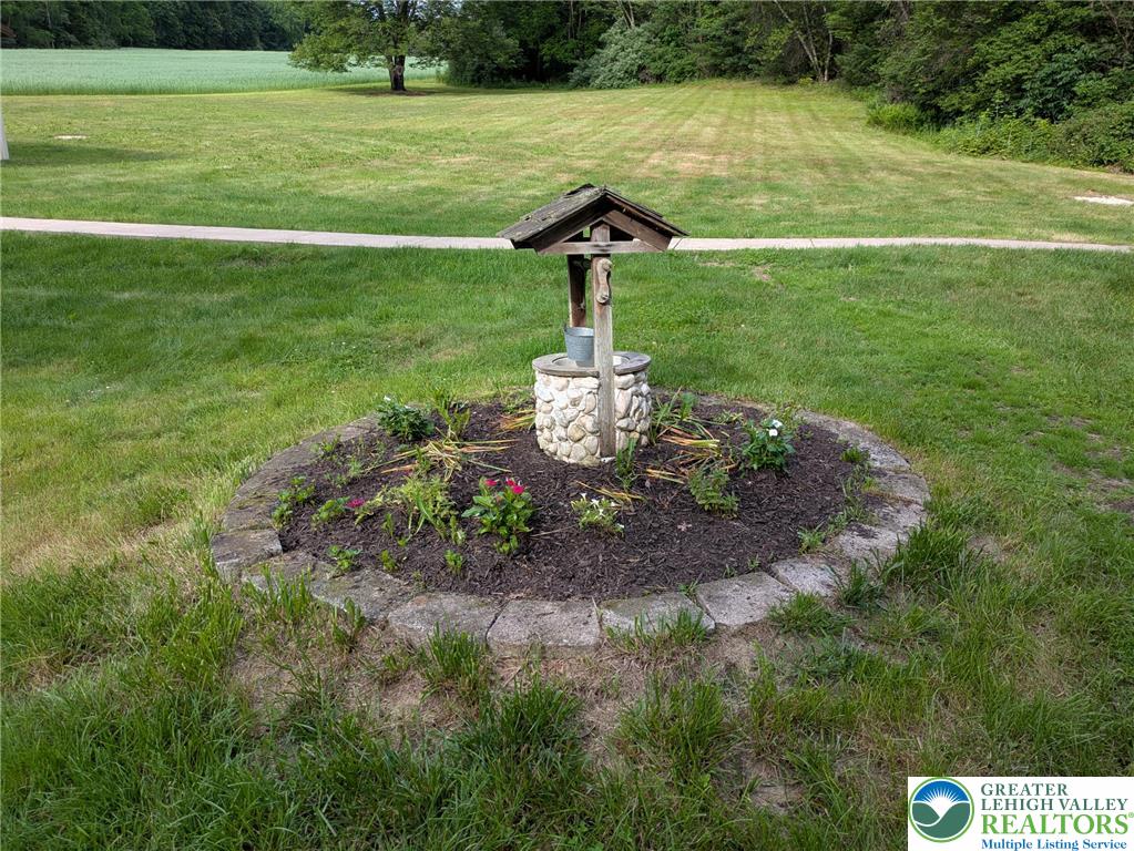 124 Sterling Valley Road Kunkletown, PA 18058 - Photo 28 of 29 a view of a garden with a lake