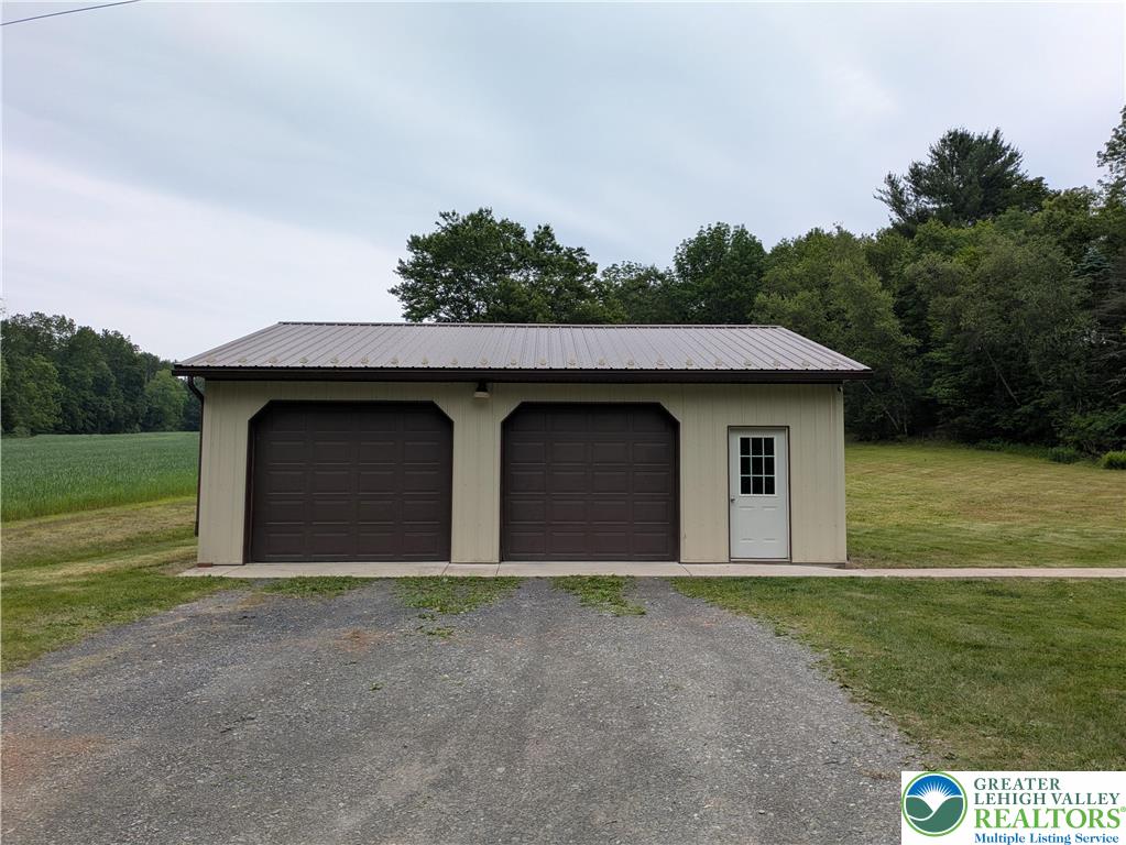 124 Sterling Valley Road Kunkletown, PA 18058 - Photo 3 of 29 a house with trees in the background