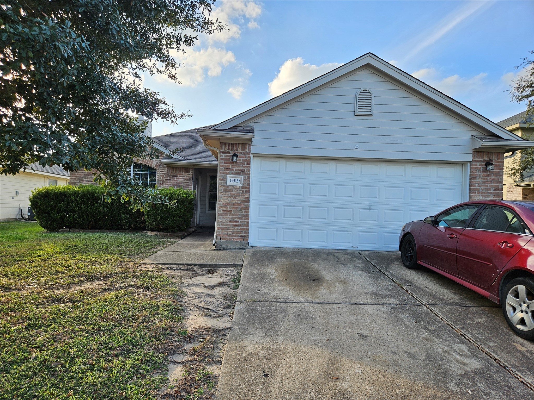 a view of a car in front of a house