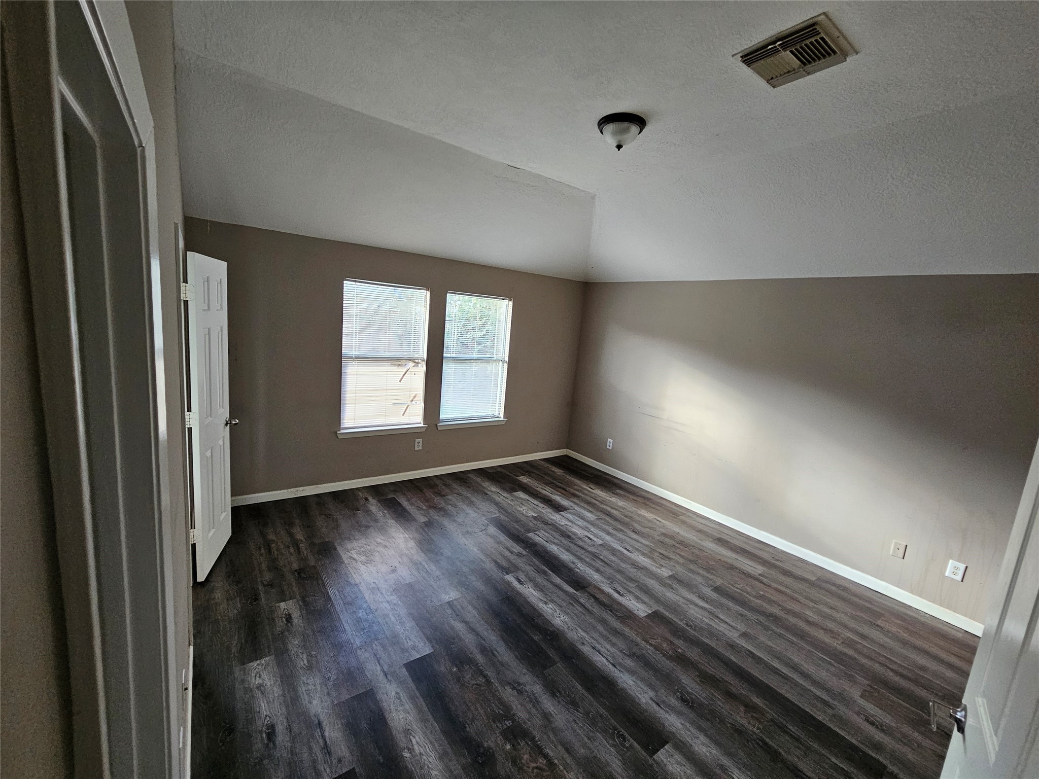 6319 Nullarbor Court Katy, TX 77449 - Photo 12 of 24 a view of an empty room with wooden floor and a window