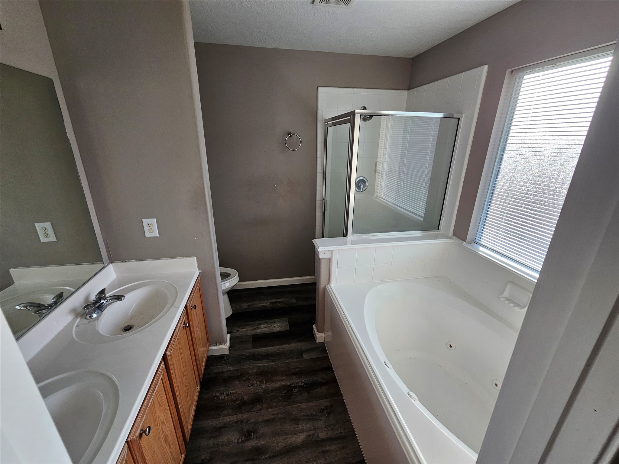 6319 Nullarbor Court Katy, TX 77449 - Photo 13 of 24 a bathroom with a tub sink and mirror