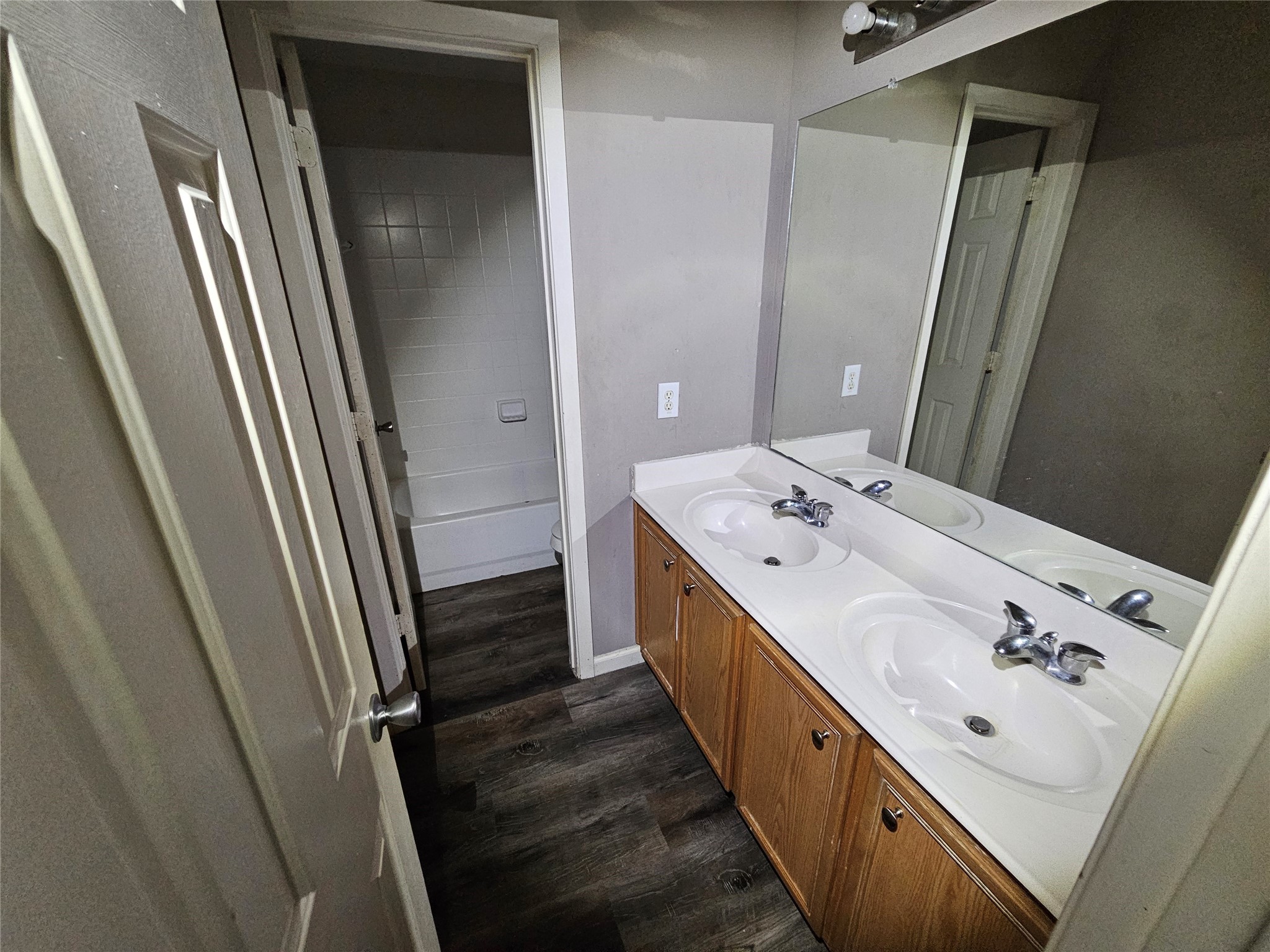 6319 Nullarbor Court Katy, TX 77449 - Photo 16 of 24 a bathroom with a double vanity sink and mirror