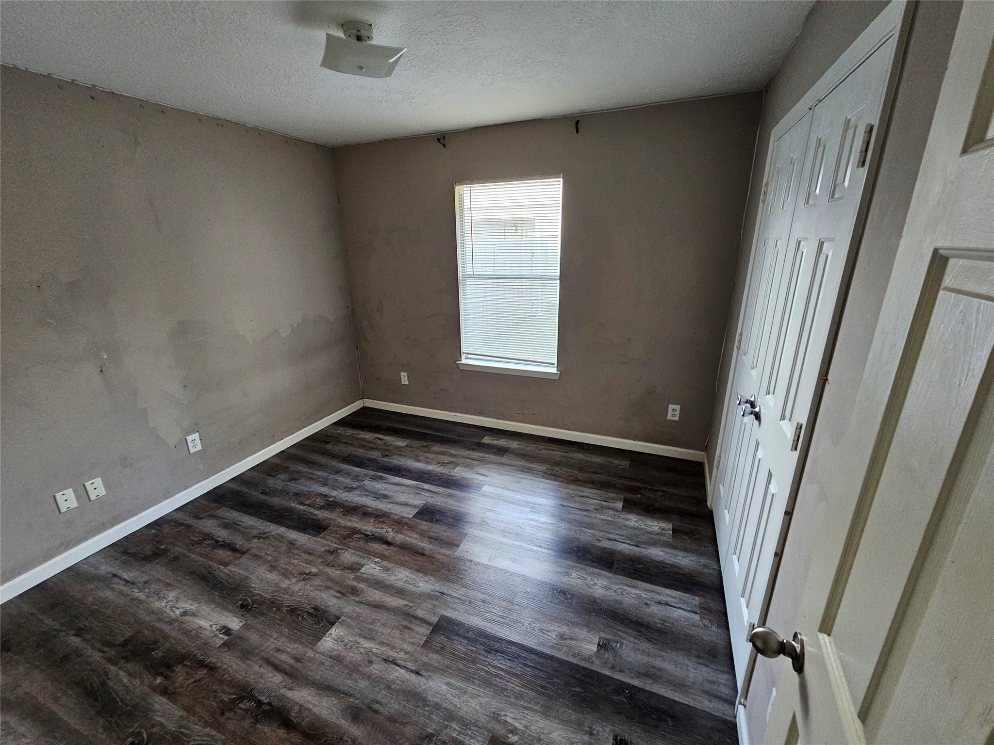6319 Nullarbor Court Katy, TX 77449 - Photo 17 of 24 a view of a room with wooden floor and window