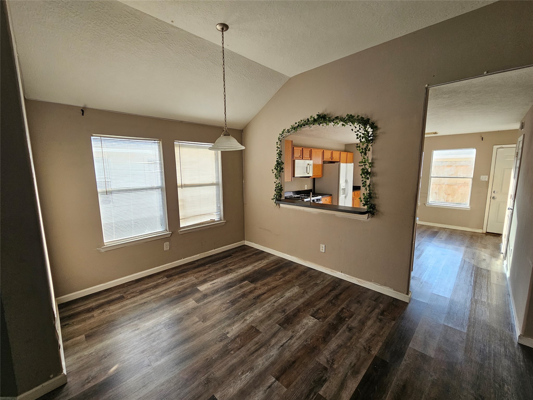 6319 Nullarbor Court Katy, TX 77449 - Photo 7 of 24 wooden floor in an empty room with a window