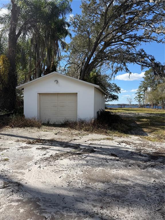 12518 Lake Mary Jane Road Orlando, FL 32832 - Photo 13 of 33 a front view of a house with a yard