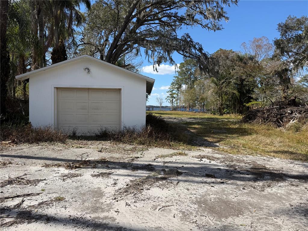12518 Lake Mary Jane Road Orlando, FL 32832 - Photo 14 of 33 a front view of a house with a yard