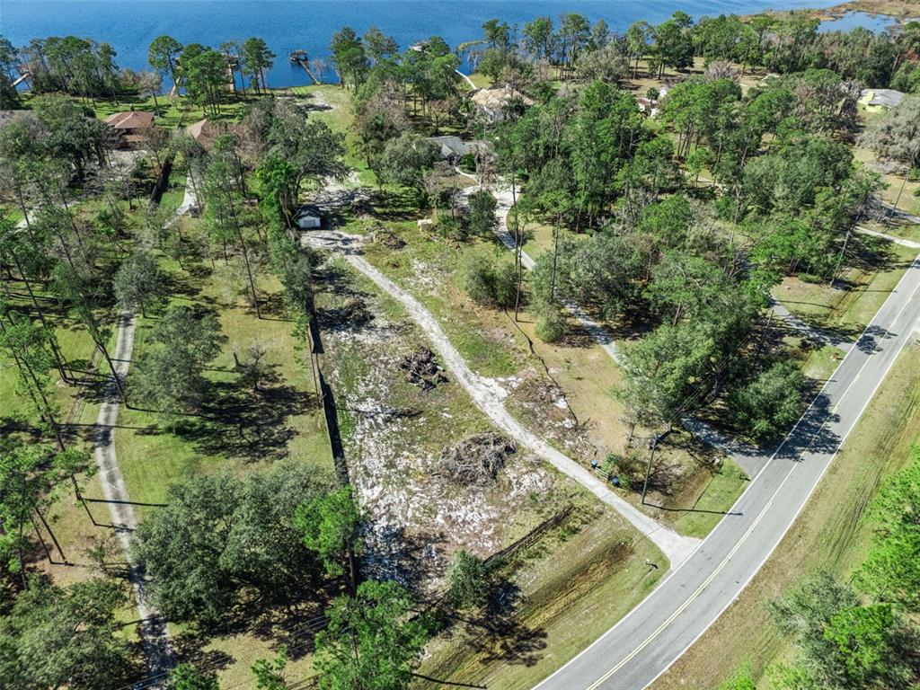 12518 Lake Mary Jane Road Orlando, FL 32832 - Photo 21 of 33 an aerial view of residential houses with outdoor space and trees