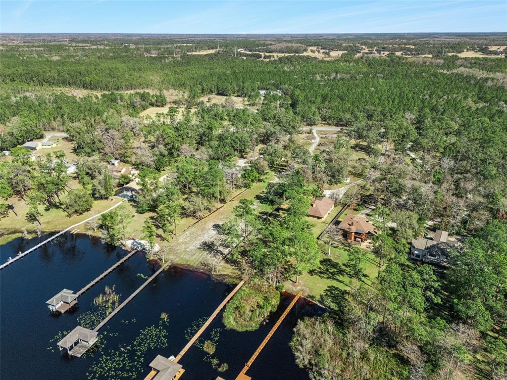 12518 Lake Mary Jane Road Orlando, FL 32832 - Photo 5 of 30 an aerial view of residential houses with outdoor space and trees