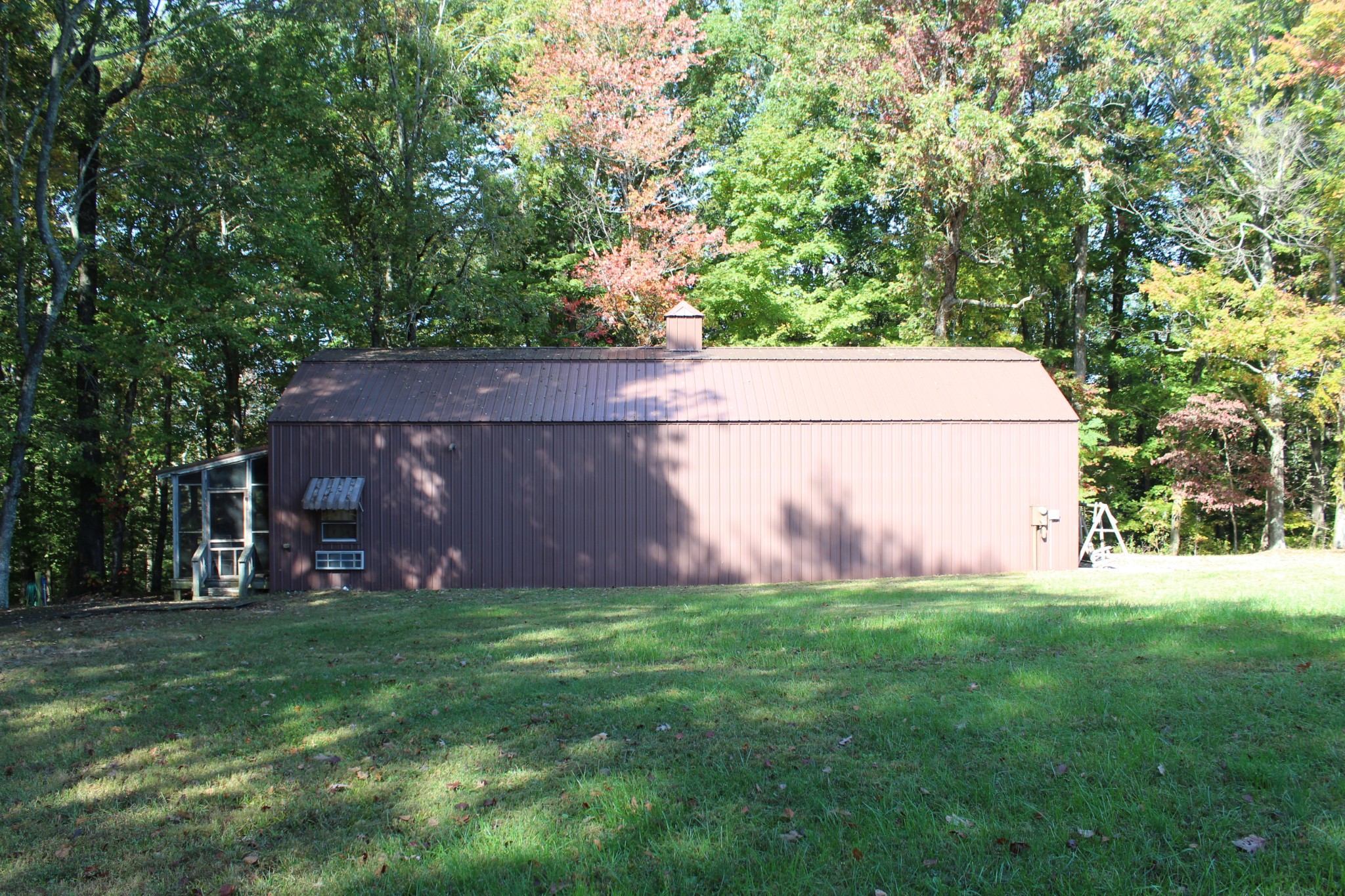 249 Claude Fox Road Lafayette, TN 37083 - Photo 13 of 68 a view of a backyard with a small cabin