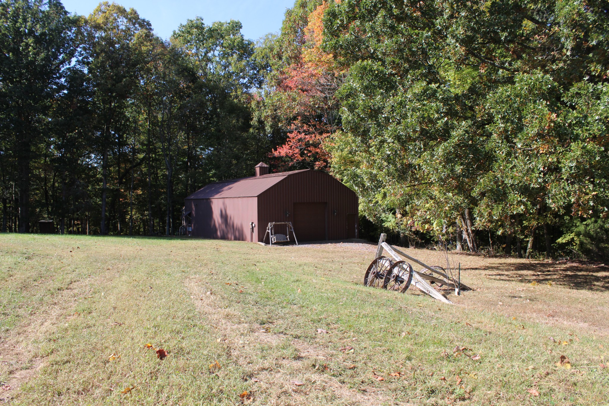 249 Claude Fox Road Lafayette, TN 37083 - Photo 5 of 68 a backyard of a house with a yard and garage