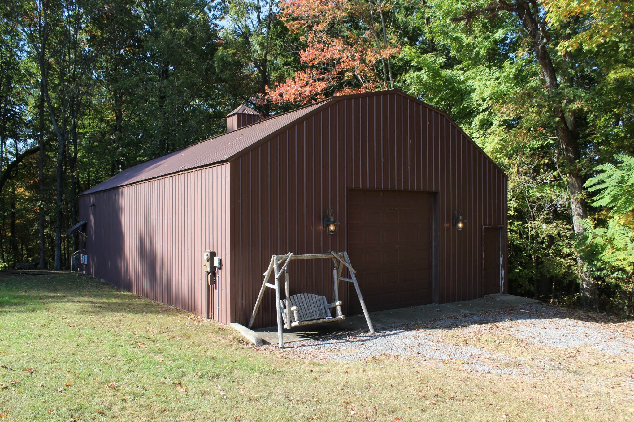 249 Claude Fox Road Lafayette, TN 37083 - Photo 10 of 68 a backyard of a house with barbeque oven and yard