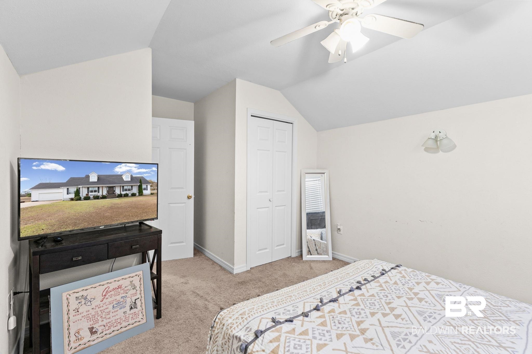 3842 Experiment Farm Road Monroeville, AL 36460 - Photo 52 of 59 Bedroom featuring lofted ceiling, a closet, light colored carpet, and a ceiling fan