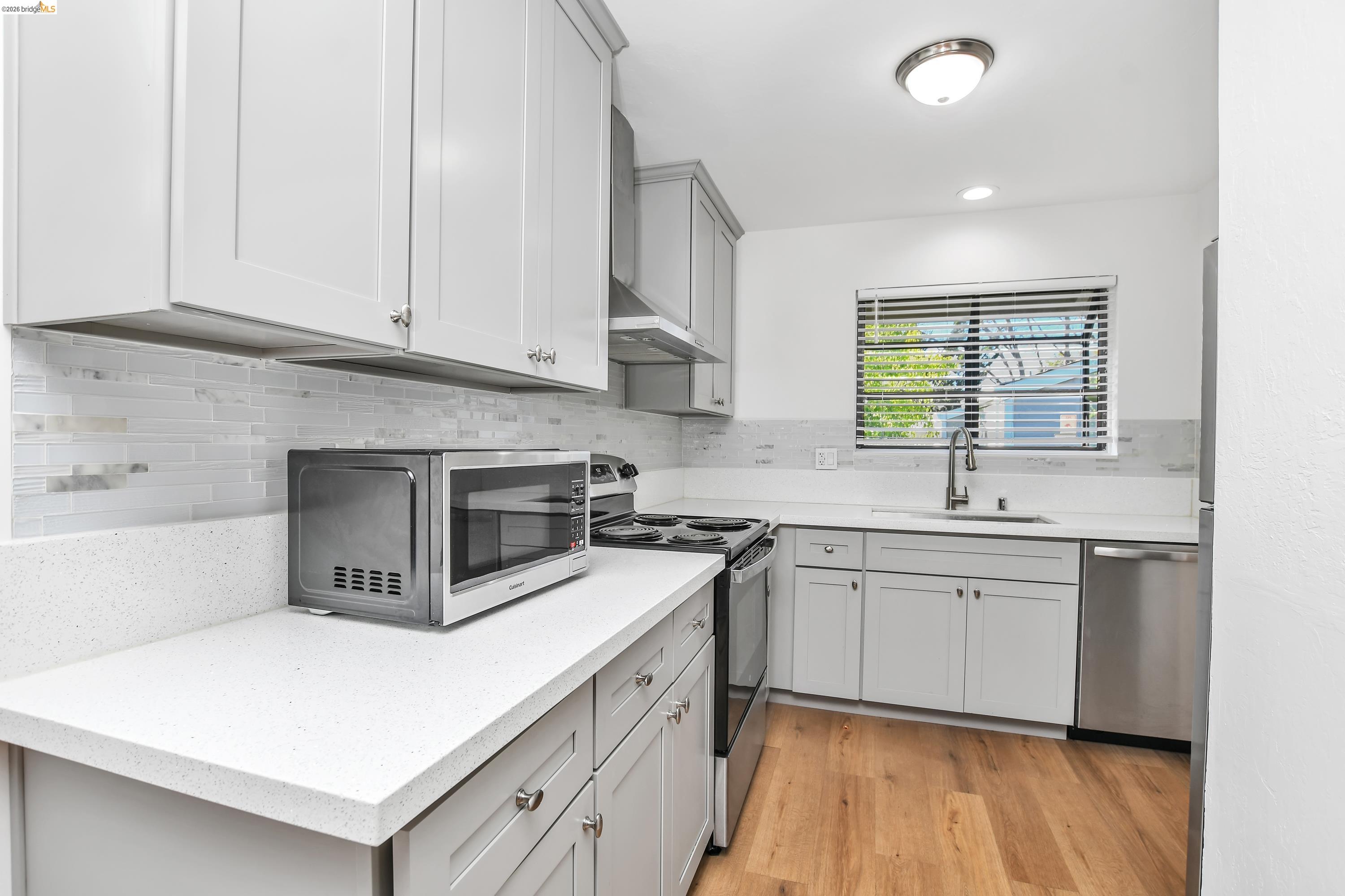 900 Southampton Road Benicia, CA 94510 - Photo 4 of 22 a kitchen with cabinets appliances a sink and a window