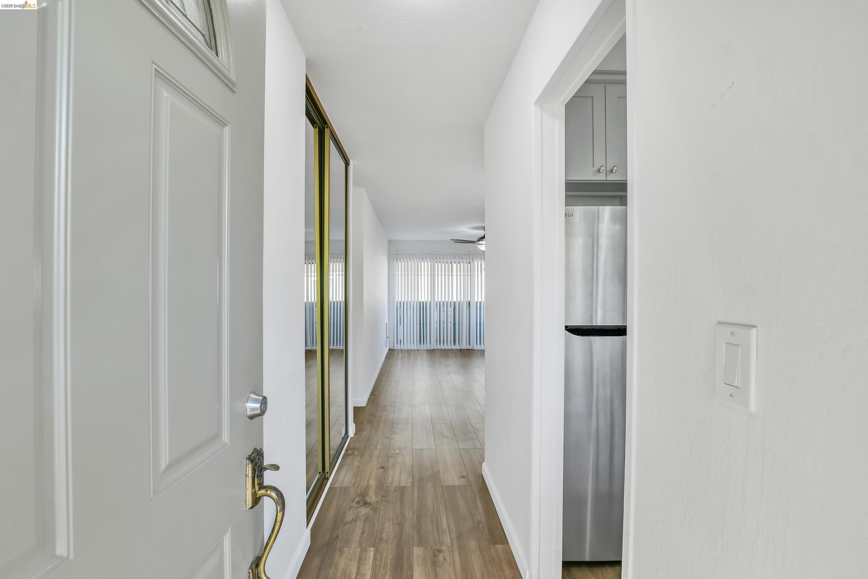 900 Southampton Road Benicia, CA 94510 - Photo 10 of 22 a view of a hallway with wooden floor