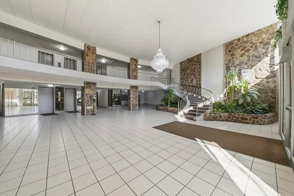 a view of a living room and entryway