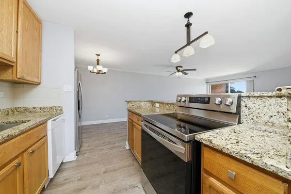 a kitchen that has a sink and a stove