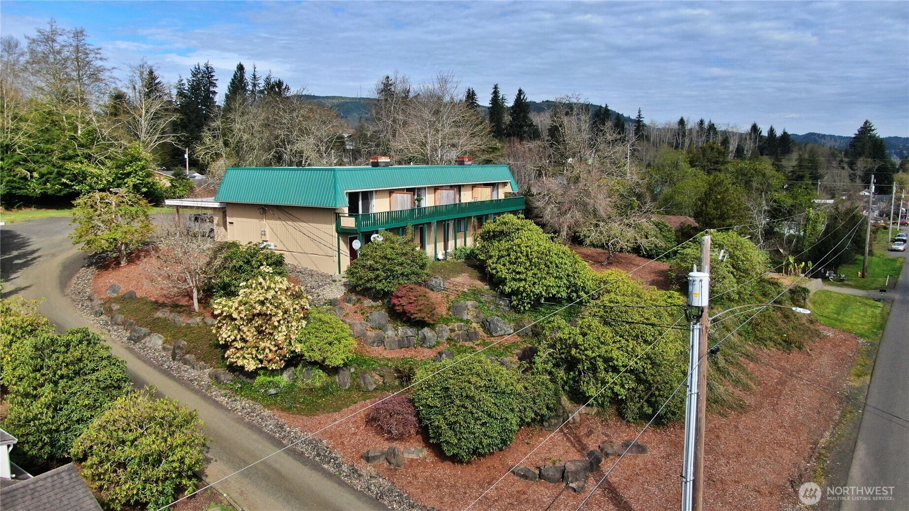 an aerial view of a house with a garden