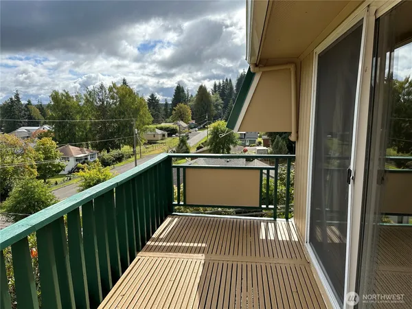 a view of a garden with an outdoor seating