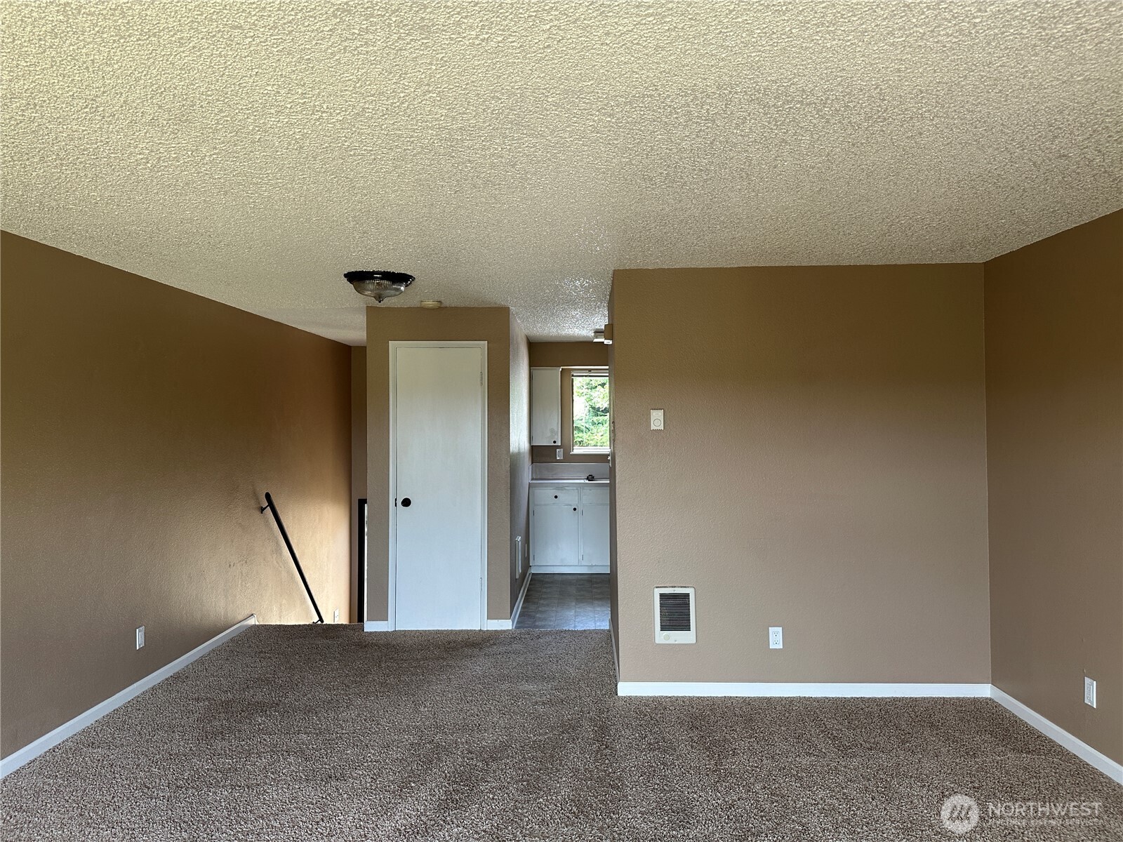 910 Barnhart Street Raymond, WA 98577 - Photo 19 of 38 an empty room with closet and wooden door