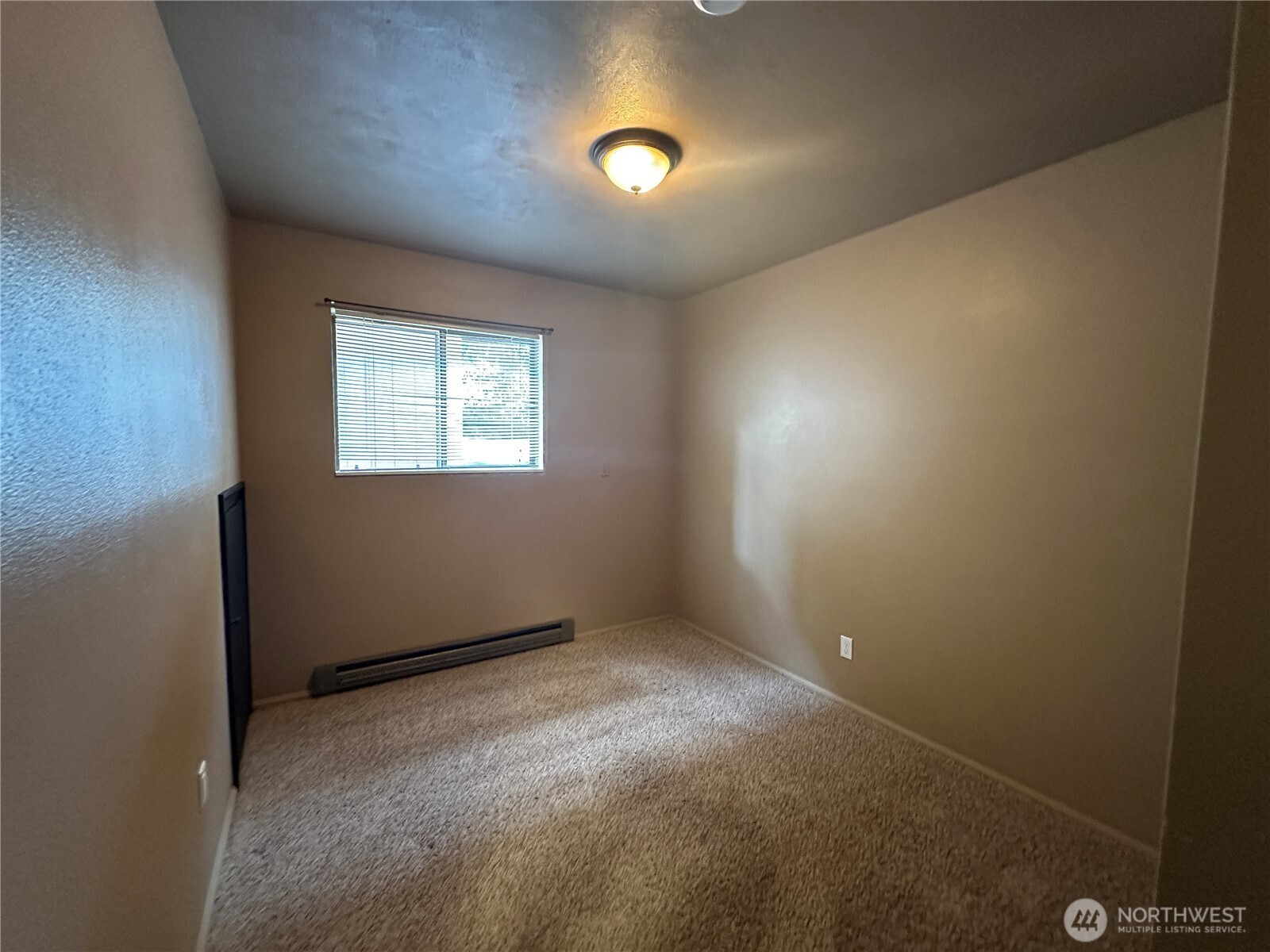 910 Barnhart Street Raymond, WA 98577 - Photo 23 of 38 an empty room with windows and entrance