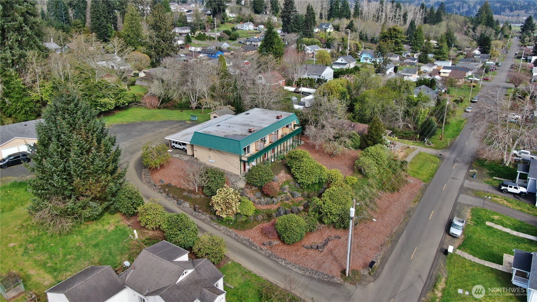 910 Barnhart Street Raymond, WA 98577 - Photo 32 of 38 an aerial view of a house with a yard and lake view