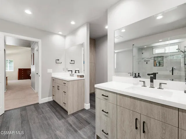 a spacious bathroom with a double vanity sink double and mirror
