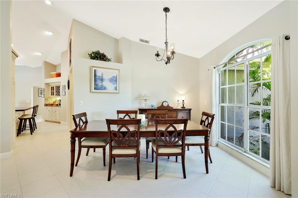 146 Muirfield Circle Naples, FL 34113 - Photo 11 of 31 a view of a dining room with furniture window and outside view