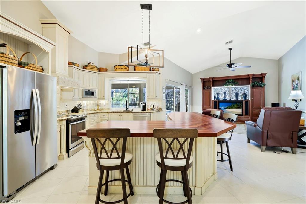 146 Muirfield Circle Naples, FL 34113 - Photo 12 of 31 a dining room with furniture and window