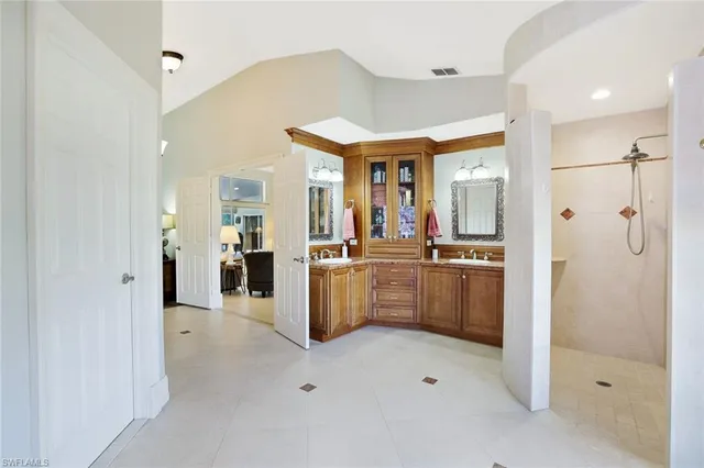 a kitchen with a refrigerator and sink