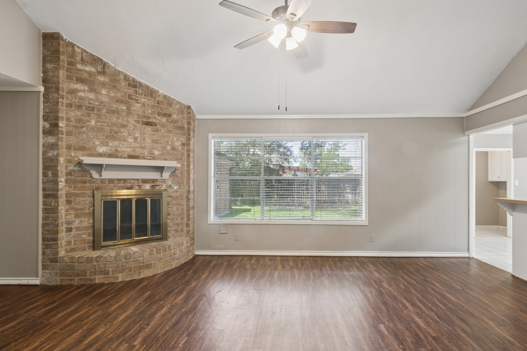 2607 Allyson Court Spring, TX 77373 - Photo 4 of 25 a view of an empty room with wooden floor and a window