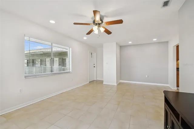 a view of kitchen with furniture and white cabinets