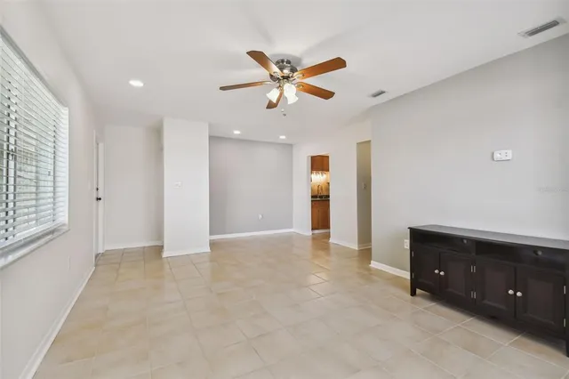a kitchen with stainless steel appliances granite countertop a sink and a refrigerator