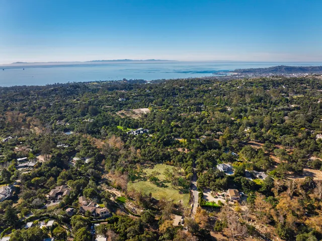 an aerial view of residential building and green space