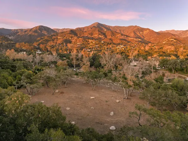 a view of a town with mountains in the background