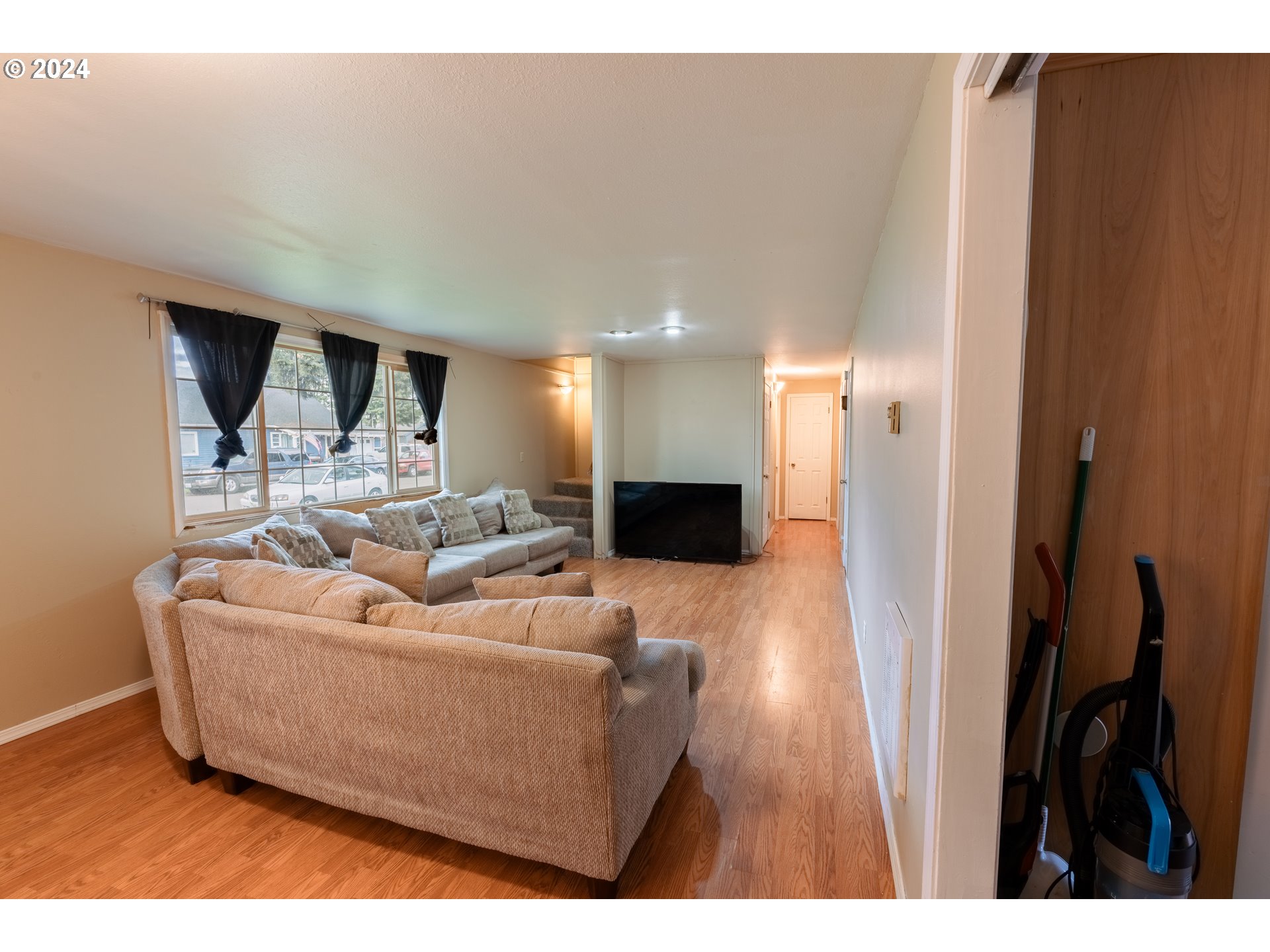 9111 Northeast 73rd Street Vancouver, WA 98662 - Photo 13 of 33 a living room with furniture and a wooden floor