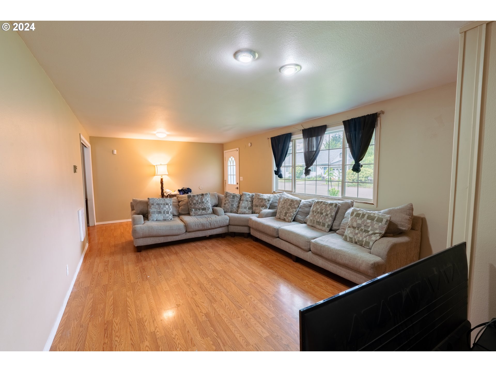 9111 Northeast 73rd Street Vancouver, WA 98662 - Photo 14 of 33 a living room with furniture and a wooden floor