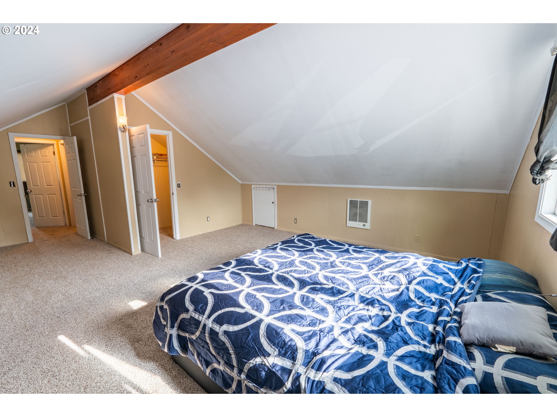 9111 Northeast 73rd Street Vancouver, WA 98662 - Photo 26 of 33 a bedroom with a bed and a window