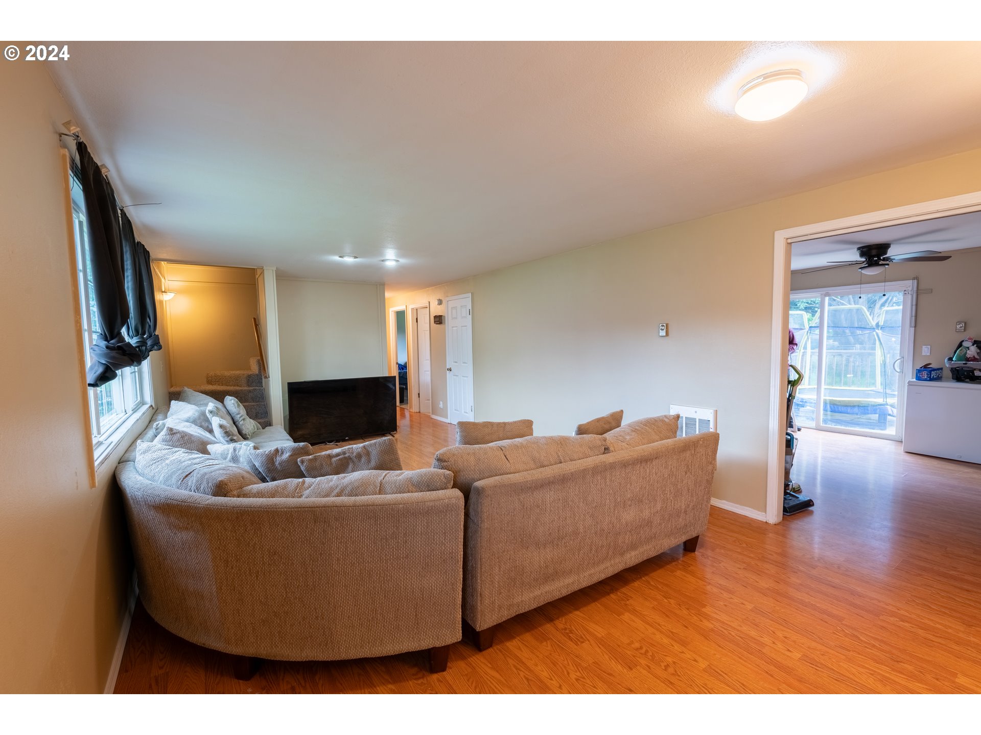 9111 Northeast 73rd Street Vancouver, WA 98662 - Photo 10 of 33 a living room with furniture and a flat screen tv