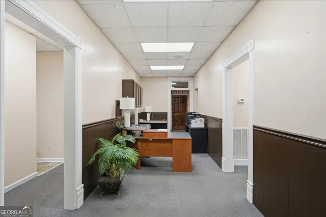 a kitchen with stainless steel appliances a stove a sink cabinets and a window